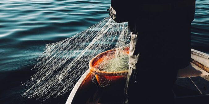 man holding a fishnet