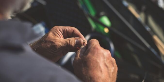 a man is holding something in his hands